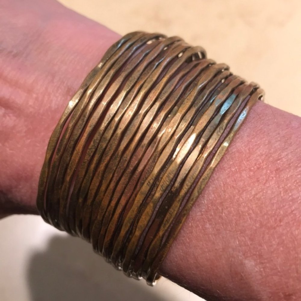 Pretty stacked gold bangle cuff bracelet.